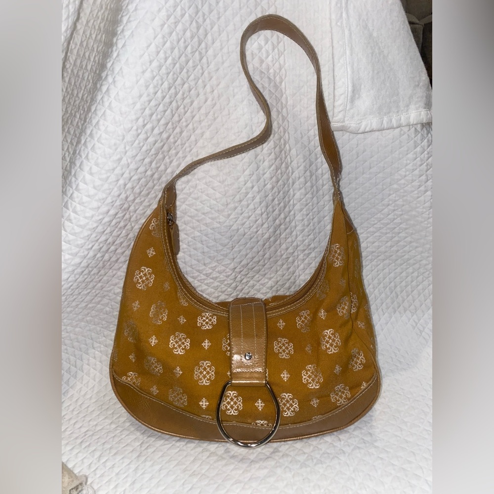 Orange and white patterned slouch shoulder bag with silver hardware